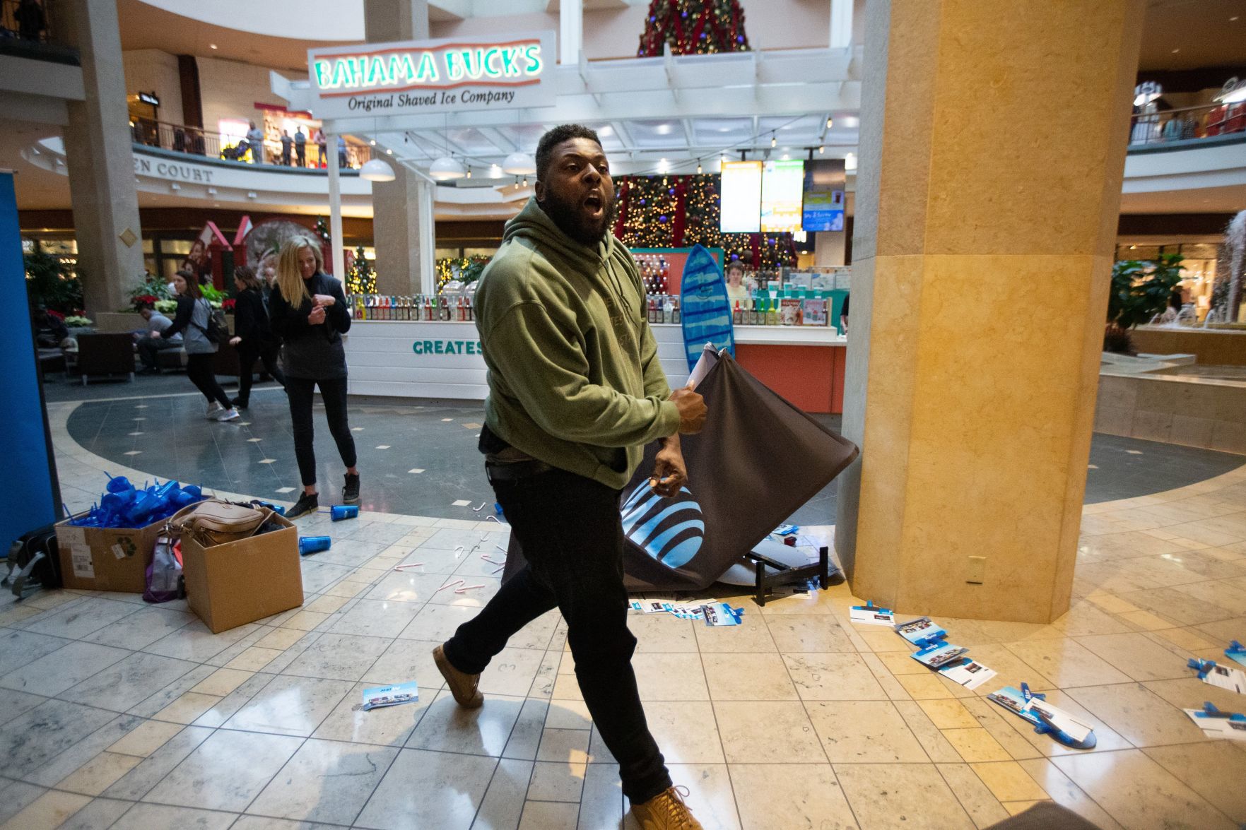 Protesters march in the St. Louis Galleria on Black Friday
